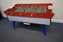 A FRENCH PARTIALLY PAINTED FOOSBALL TABLE, each arm with painted cast iron players, length 156cm x