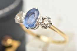 A SAPPHIRE AND DIAMOND THREE STONE RING, set with an oval shape sapphire, measuring approx 9.1 by
