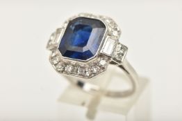 AN EARLY TO MID 20TH CENTURY SAPPHIRE AND DIAMOND CLUSTER RING, the handmade mount set with a
