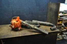 A PARKER PETROL LEAF BLOWER VAC with pipework and collection bag (engine pulls freely but hasn't