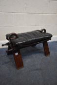 A HARDWOOD AND BRASS INLAID CAMEL STOOL, with black leatherette cushion, condition report: good
