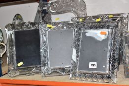 A GROUP OF NINE GLASS PHOTOGRAPH FRAMES to include three Rosenthal glass frames comprising a pair