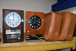 TWO CLOCKS AND TWO SUITCASES comprising a Jantar vintage wall clock, marked Made in USSR, with