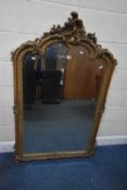 A 19TH CENTURY GILT WOOD AND RESIN BEVELLED EDGE OVER-MANTEL MIRROR, with scrolled and foliate