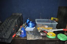 A COLLECTION OF AUTOMOTIVE TOOLS AND ACCESSORIES including a bottle jack, two ramps, three hand
