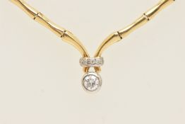 A YELLOW METAL DIAMOND SET ARTICULATED NECKLACE, estimated principal diamond weight 0.30ct,