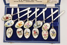 TWO SETS OF SILVER AND ENAMEL TEASPOONS, the first a cased set of hand painted and enamel bird