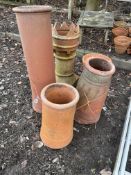 FIVE CHIMNEY POTS of varying styles and sizes