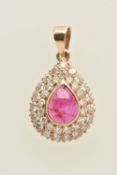 A YELLOW METAL RUBY AND DIAMOND CLUSTER PENDANT, unclear stamp mark to the bail approximate length