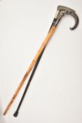 TWO WALKING STICKS, the first with a silver handle in the form of a fox with pheasant in mouth,