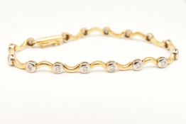 AN 18CT GOLD DIAMOND LINE BRACELET, designed as sixteen round brilliant cut diamonds, each collet
