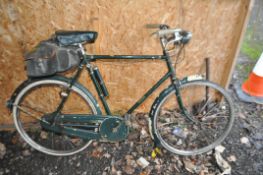 A VINTAGE RALEIGH GENTS BIKE with 23in frame, front and rear lights and saddlebag