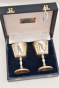 A CASED PAIR OF ELIZABETH II SILVER GOBLETS, each goblet engraved with an initial 'P', knopped stems