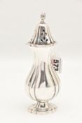 AN ELIZABETH II SILVER SUGAR CASTER, with scrolling decoration and pierced cover, hallmarked 'J B