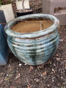 A LARGE GREEN MOTTLED GLAZED PLANT POT with ribbed balustered bowl 60cm high Condition Report; no