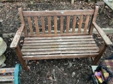 A HARDWOOD GARDEN BENCH with slatted back and seat 120cm wide Condition Report; sturdy but finish