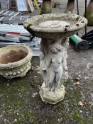 A CONCRETE BIRDBATH in the form of four ladies holding a platter aloft 76cm high Condition Report;