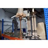 A GROUP OF LAMPS to include a pair of tri-pillared lamps (one with loss), a pair of turned table