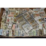 A BOX OF CIGARETTE & TRADE CARDS containing several thousand loose cards, most in full or part
