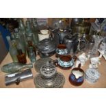 A GROUP OF GLASS AND METALWARE comprising a group of twelve glass bottles to include three Codd