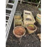 SEVEN GARDEN PLANTERS, including two pairs of square concrete planters, one pair 41cm across, the