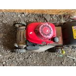 A HONDA IZY PETROL LAWN MOWER, with grassbox (engine pulls freely but hasn't been started)