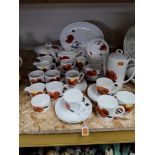 A SUSIE COOPER FOR WEDGWOOD 'CORNPOPPY' PART DINNER SERVICE comprising an oval serving platter,