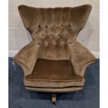 A G PLAN BLOFELD SWIVEL ARMCHAIR, with a buttoned backrest, raised on four legs with castors