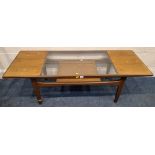 A G PLAN FRESCO MID-CENTURY TEAK COFFEE TABLE, with a glass insert, raised on tapered legs