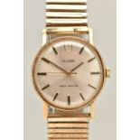 A VINTAGE TUDOR 9CT GOLD WRISTWATCH. The silver tone dial with hourly applied makers, the dial is