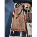 A GROUP OF TWO STRINGED INSTRUMENTS comprising a vintage Lignatone acoustic guitar and a