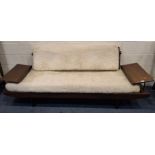 TOOTHILL, A MID-CENTURY AFROMOSIA TEAK SOFA, with a fold-over backrest, flanked by two height-