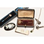 A SMALL ASSORTMENT OF JEWELLERY, to include a boxed yellow metal star set diamond stick pin,