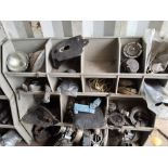 A LARGE SELECTION OF VINTAGE BRITISH MOTORCYCLE PARTS including saddles, footpegs, foot controls,
