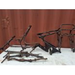 A COLLECTION OF 1950s BRITISH MOTORCYCLE FRAME PARTS, including three rear frames, one with a centre