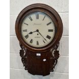 AN EARLY 20TH CENTURY OAK CASED DROP DIAL WALL CLOCK, the glass door enclosing a 12 inch dial,
