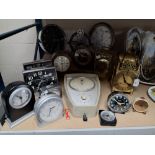 A GROUP OF TIMEPIECES IN VARIOUS FORMS to include a Timex wall clock in the form of a speedometer, a