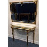 A GILT WOOD RECTANGULAR WALL MIRROR, along with a console table, with canted corners, raised on