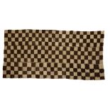 A Tibetan sleeping rug, Tsu-truk Early 20th century The checked rug composed of three long stri...
