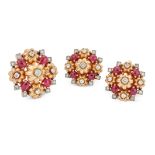 A set of three French ruby and diamond brooches, of graduated size, each designed as a cinquefoil...