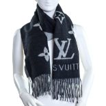 Louis Vuitton.  Monogram Giant Scarf, of classic black and grey double-toned scarf with fringe f...