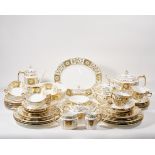 A Royal Crown Derby porcelain 'Green Derby Panel' pattern dinner, tea and coffee service, last qu...