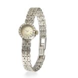 Longines. An 18ct white gold and diamond set manual wind cocktail watch  Case number 40700, Movem...