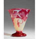 Daum  Tapered and footed vase with floral decoration, early 20th century  Acid etched cameo glas...