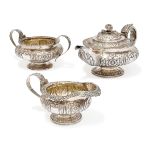 A George IV three piece silver tea set.  William Hunter,  London, 1825.  The service comprisin...
