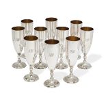 A set of ten Elizabeth II silver champagne flutes.  Asprey & Co.,  London, 1975.  The elongate...
