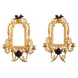 A pair of gilt and patinated bronze four-light girandoles, late 20th century, surmounted with bil...
