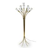 A French brass and glass ten light standard lamp, c.1950, wired for electricity, 175cm high  It ...