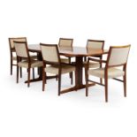 A Rosewood extending dining table and six dining chairs, circa 1960, designed by Svegards Markary...