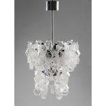 A Murano glass and chromed steel ceiling light by Mazzega, c.1970, 75cm high, 44cm wide  It is t...